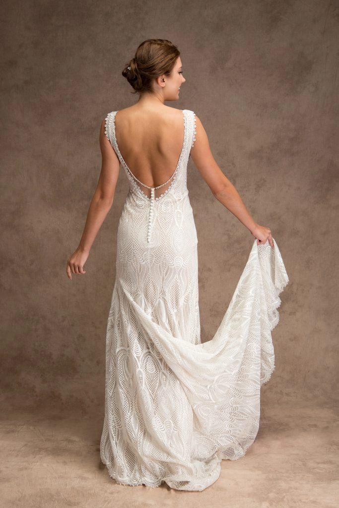 Back of bride wearing an ivory art deco wedding dress with a back opening with buttons