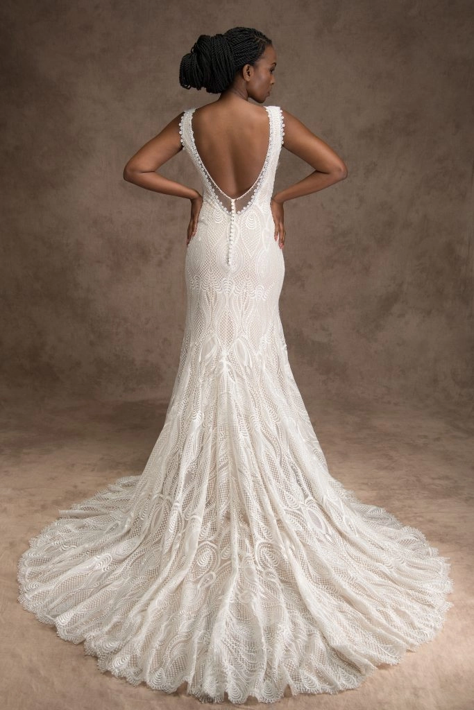 Back of bride wearing an ivory art deco wedding dress with a back opening with buttons