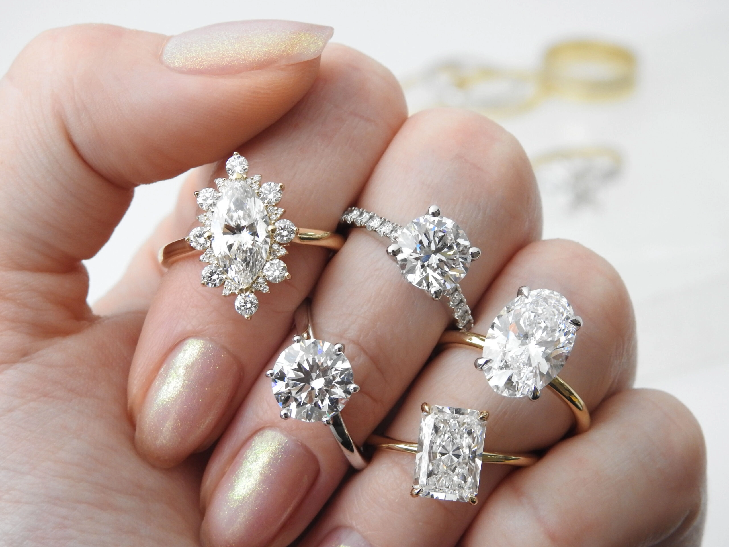 lab-grown diamond engagement ring on hand different ring styles