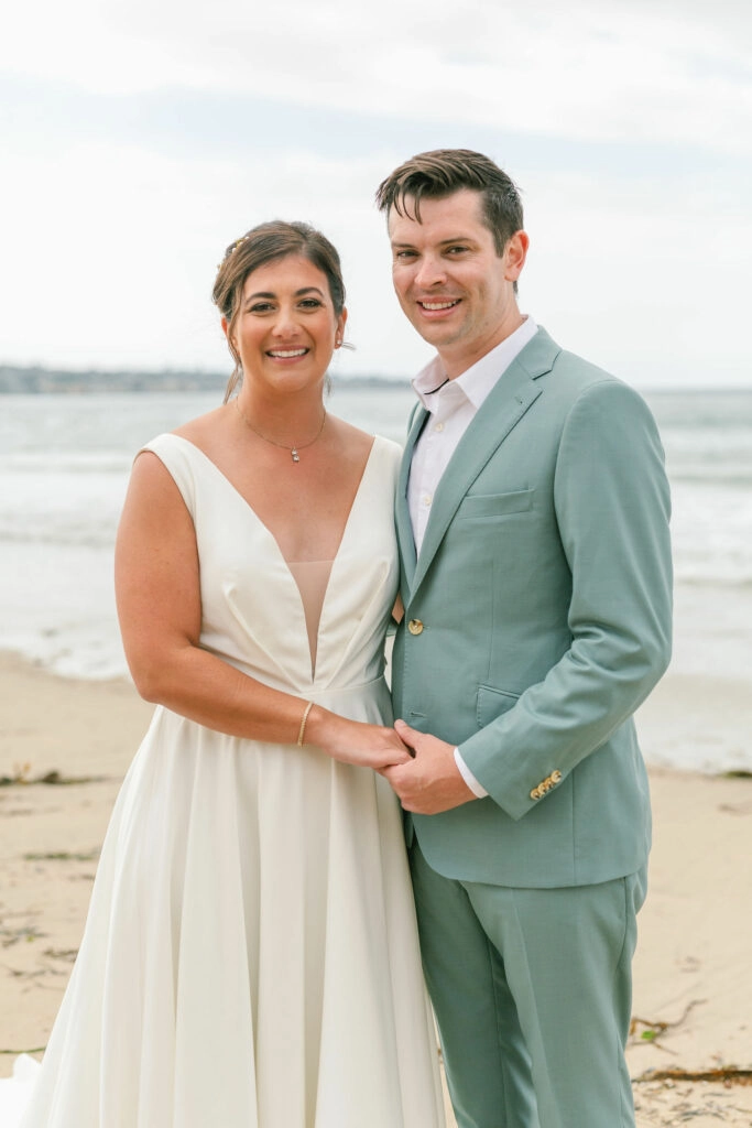 V neck crepe wedding dress full skirt on beach wedding groom in ocean green suit